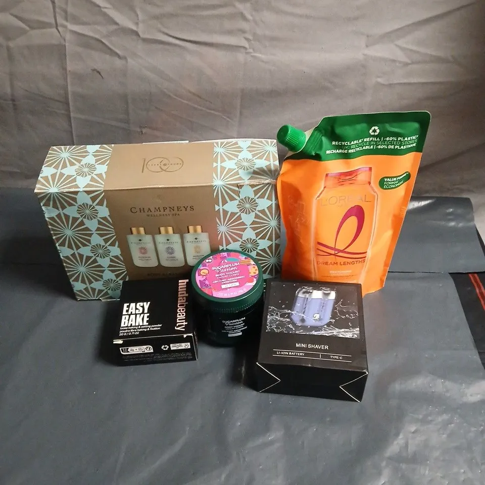 APPROXIMATELY 15 ASSORTED COSMETIC ITEMS TO INCLUDE CHAMPNEYS BODY CLEANSER TRIO, LOREAL SHAMPOO, MINI SHAVER, SUGARPLUM BODY YOGHURT, HUDA BEAUTY ETC