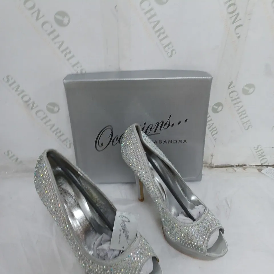 LARGE BOX OF APPROXIMATELY 10 BOXED OCCASIONS BY CASANDRA JEWELLED SILVER OPEN TOE HEELS IN VARIOUS SIZES 