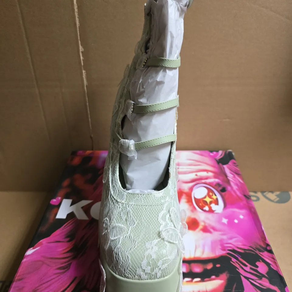 BOXED PAIR OF KOI WILD LOTUS BUTTERFLY LACE PLATFORM HEELS – GREEN, UK 10
