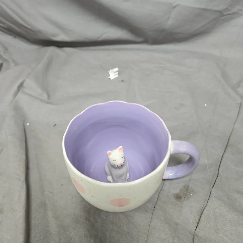 SASS & BELLE CAT SURPRISE MUG – LILAC INTERIOR, WHITE WITH PINK POLKA DOTS, CAT FIGURINE INSIDE