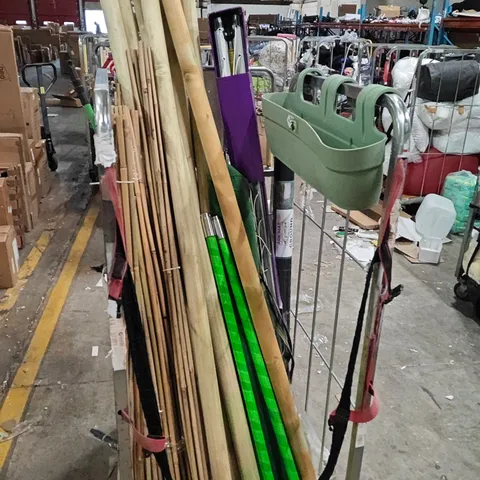 CAGE OF ASSORTED GARDEN AND LANDSCAPE ITEMS TO INCLUDE BAMBOO RODS, WOODEN POLES, GROUND MAT ROLL AND RAKE
