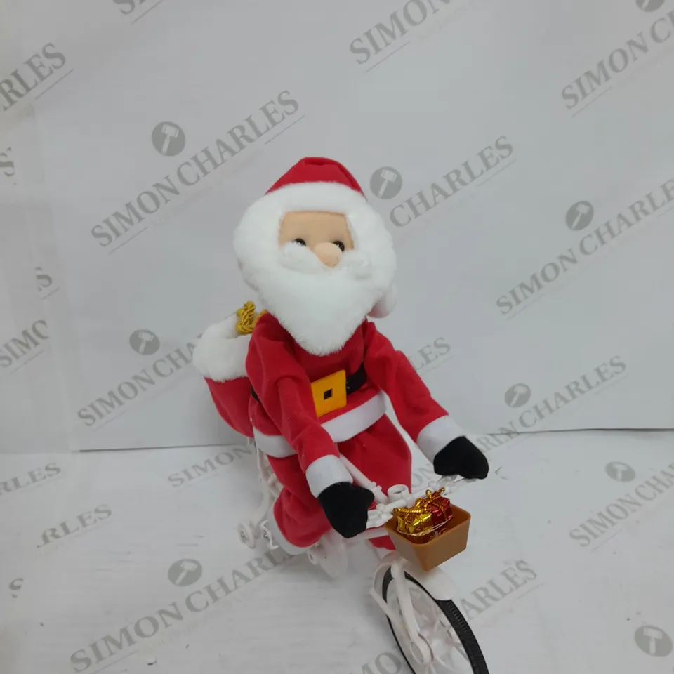 MR CHRISTMAS PRE-LIT MUSICAL CYCLING SANTA