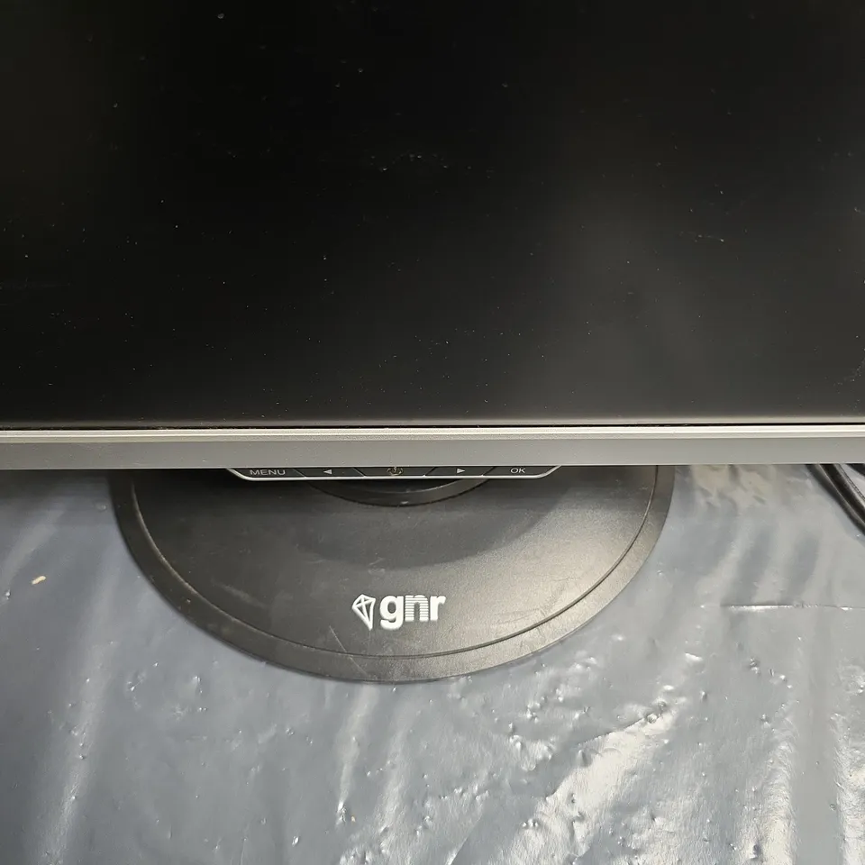 GNR COMPUTER MONITOR – BLACK BEZEL WITH SILVER TRIM ON CIRCULAR STAND .