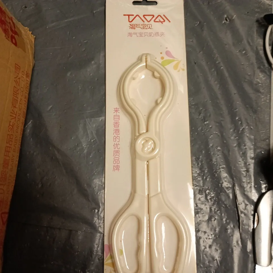 BOX OF APPROXIMATELY 12 BABY BOTTLE TONGS 