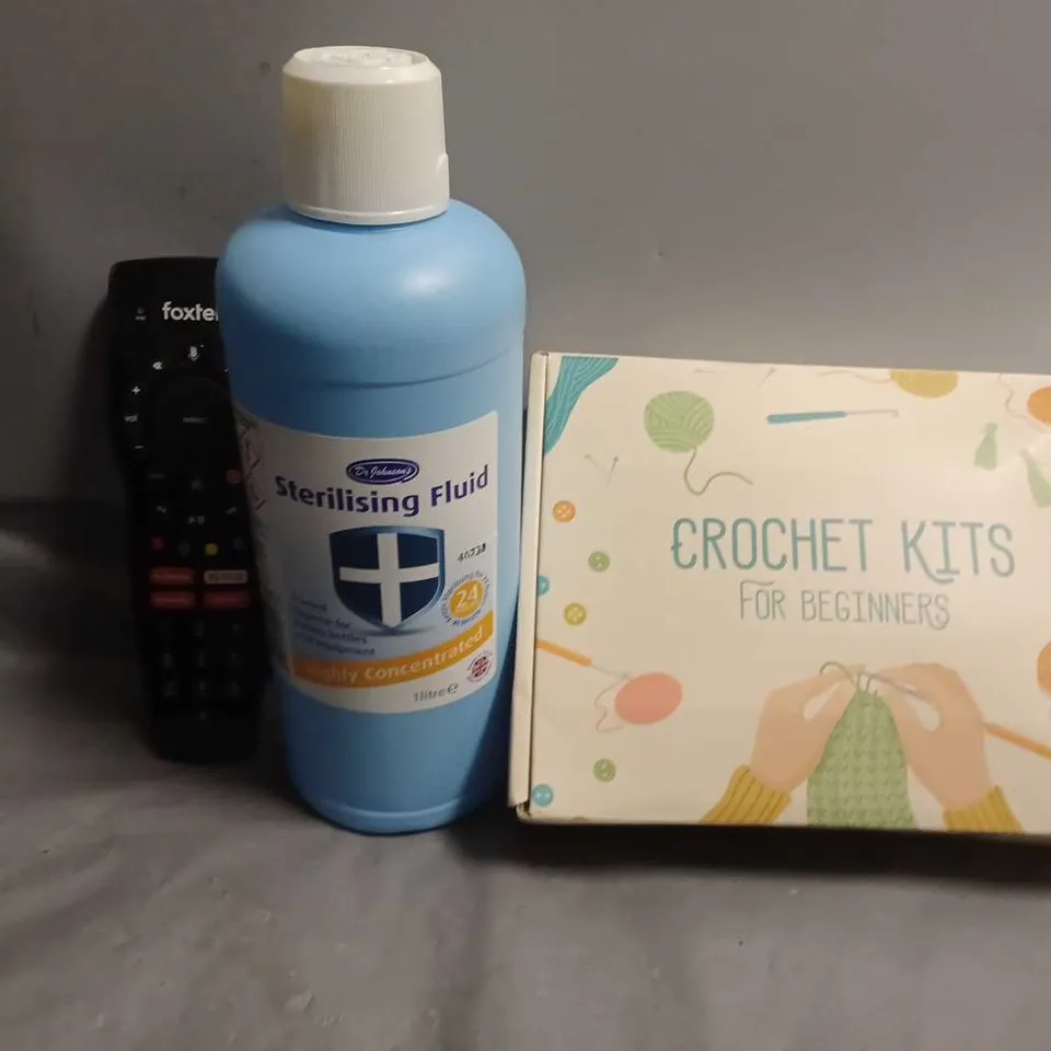 APPROXIMATELY 6 ASSORTED ITEMS TO INCLUDE - CROCHET KITS , FOXTEL REMOTE , WASHING UP LIQUID ETC