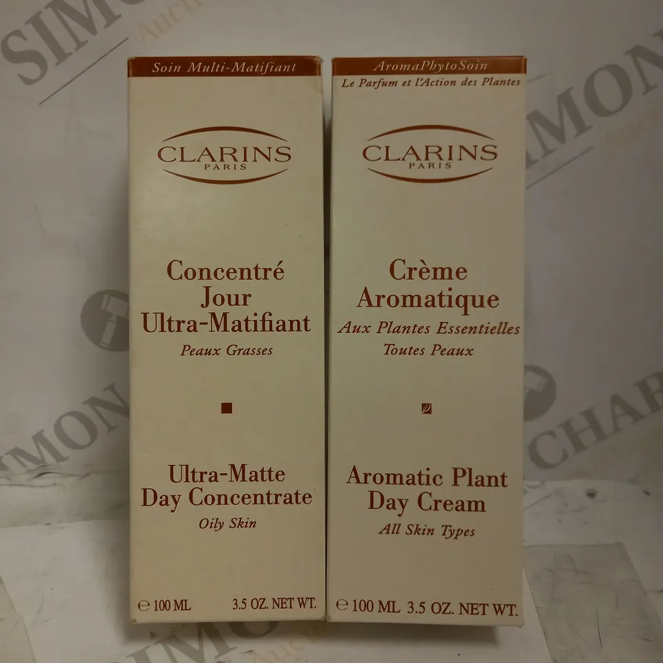 LOT OF 2 ASSORTED CLARINS PRODUCTS TO INCLUDE AROMATIC PLANT DAY CREAM 100ML & ULTRA-MATTE DAY CONCENTRATE 100ML