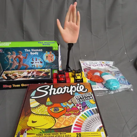 MEDUIM BOX OF ASSORTED TOYS AND GAMES TO INCLUDE RING TOSS GAMES, CAR TOYS AND SHARPIE PENS