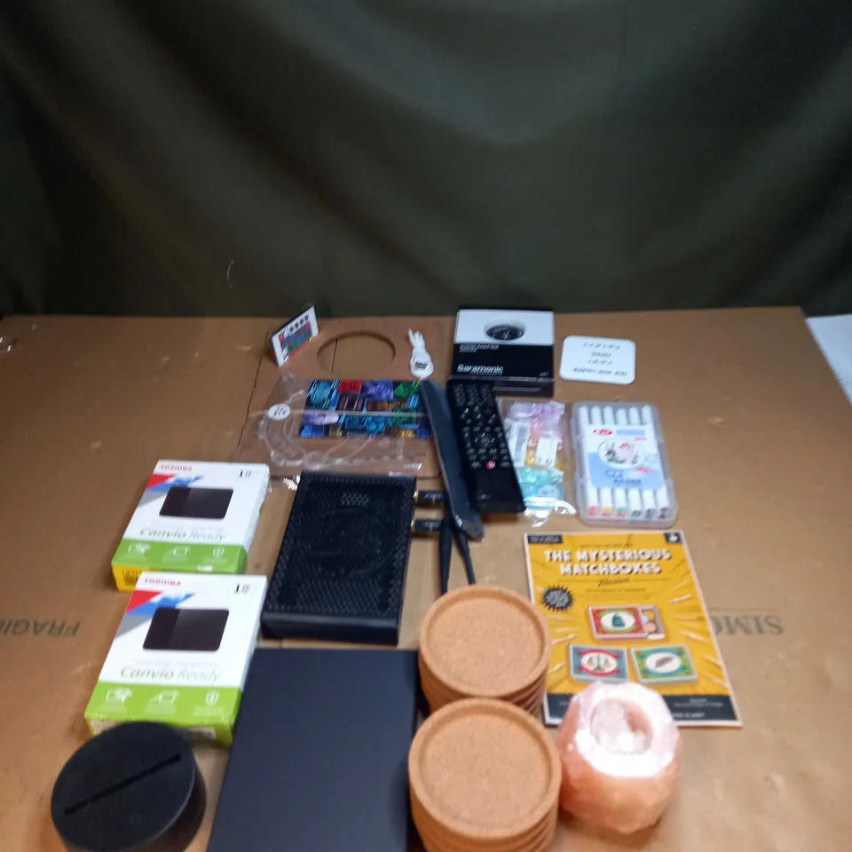 LOT OF ASSORTED ITEMS TO INCLUDE PENS, WIFI ROUTERS AND PORTABLE STORAGE 