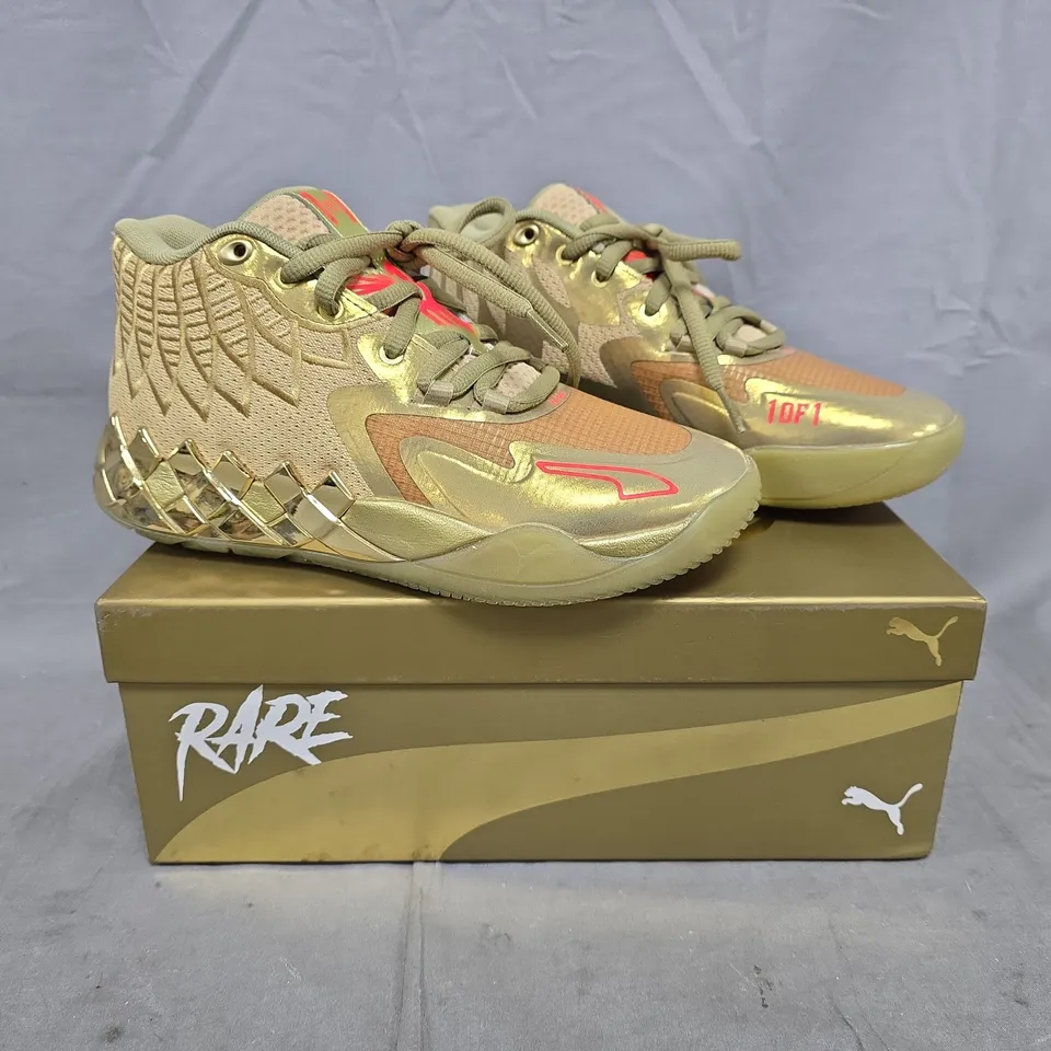 BOXED PAIR OF PUMA MB.01 GOLDEN CHILD SHOES IN METALLIC GOLD SIZE UK 4