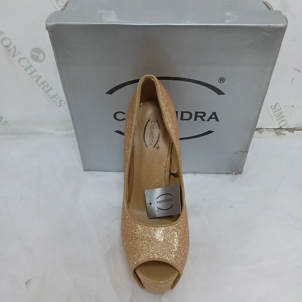 LARGE BOX OF BOXED APPROXIMATELY 10 CASSANDRA OPEN TOE HEELS IN GOLD GLITTER IN VARIOUS SIZES