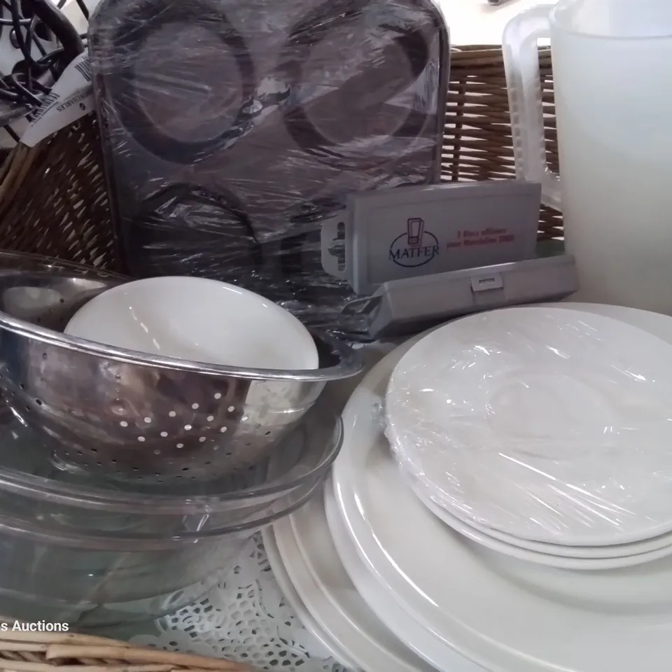 TWO WICKER BREAD BASKETS CONTAINING ASSORTED CATERING ITEMS, INCLUDING PLATTERS, TRAYS, CROCKERY, WIRE STRAINERS.