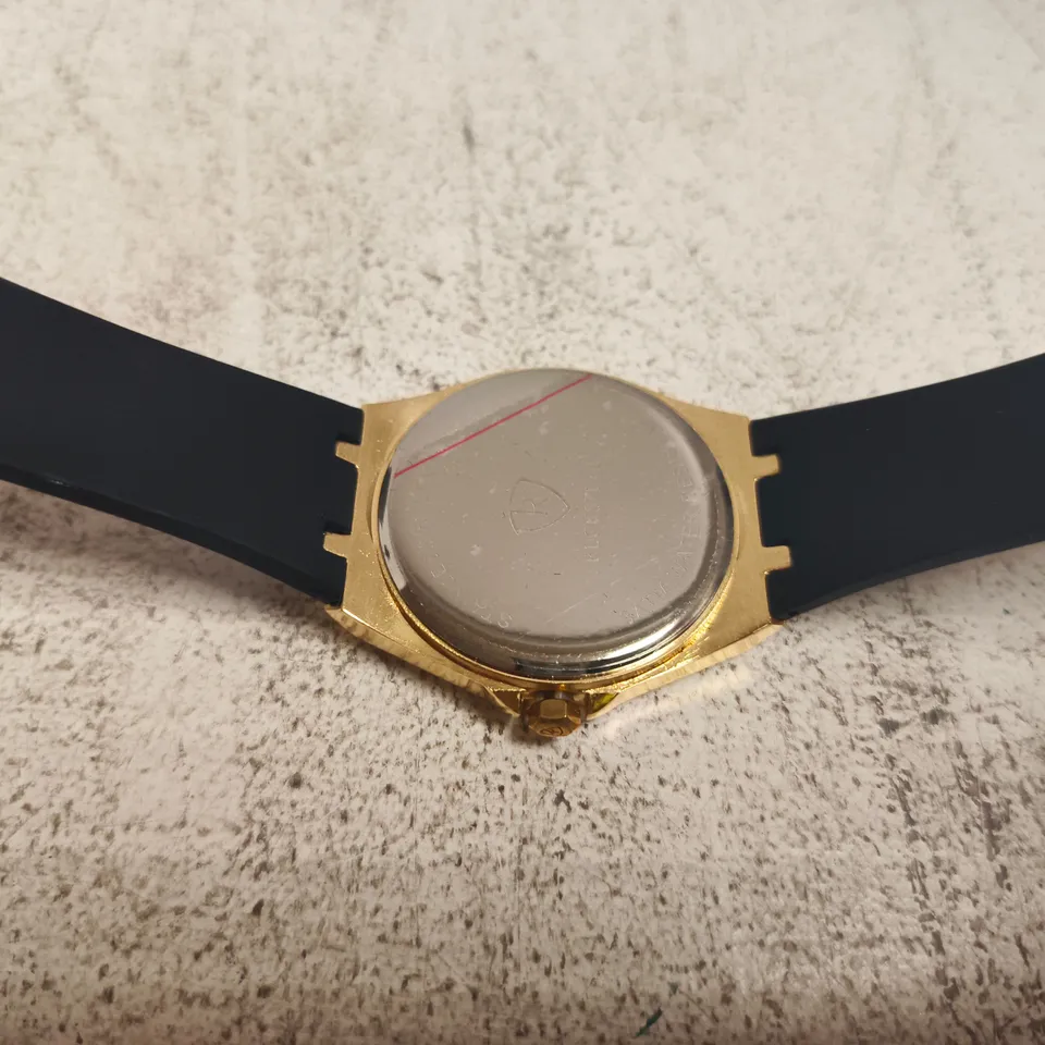 RUCKSTUHL GOLD-TONE WRISTWATCH – BLACK DIAL, RUBBER STRAP