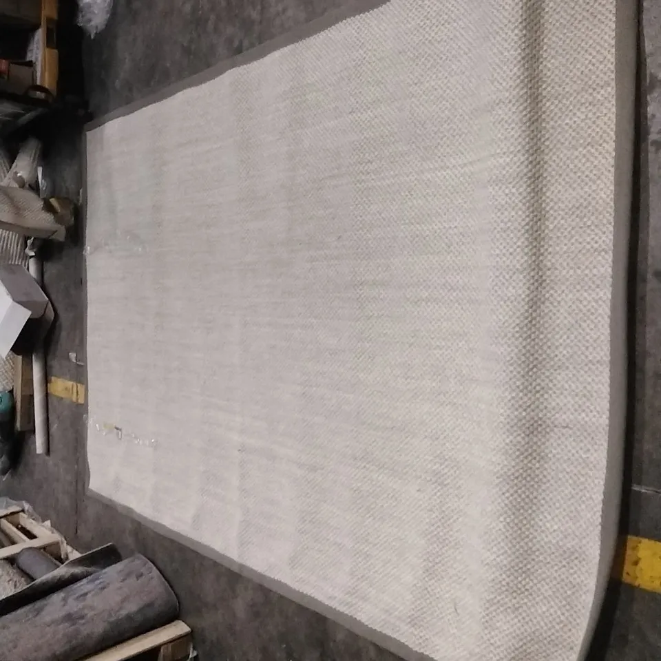 TORBIN MACHINE WOVEN BEIGE RUG APPROXIMATELY 260X180CM