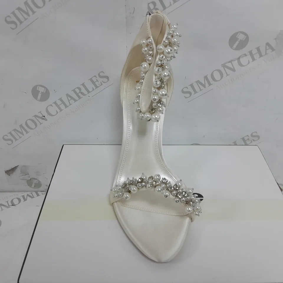 BOXED PAIR OF DUNE WIDE FIT BEADED ANKLE TRIM HEELS IN IVORY SATIN - SIZE 6