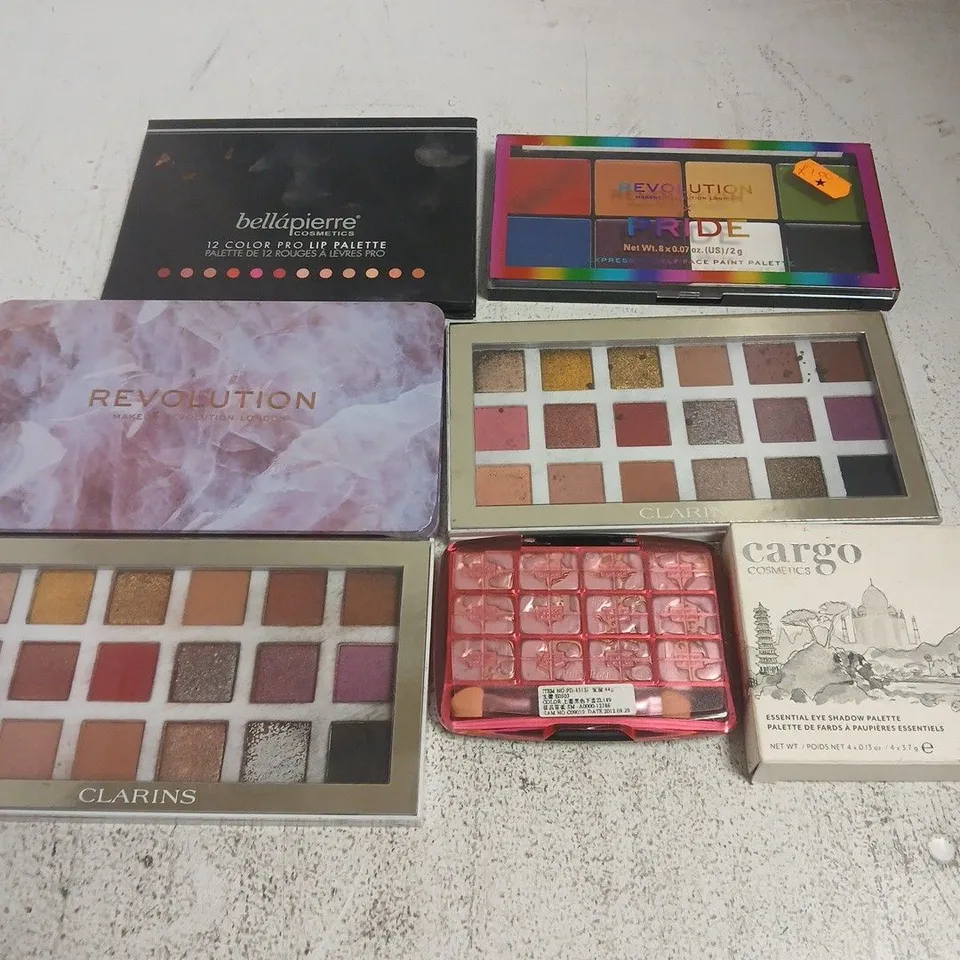 APPROXIMATELY 20 ASSORTED COSMETICS ITEMS TO INCLUDE CARGO EYE SHADOW PALETTE, CLARINS PALETTE, REVOLUTION FOREVER FLAWLESS, ETC - COLLECTION ONLY