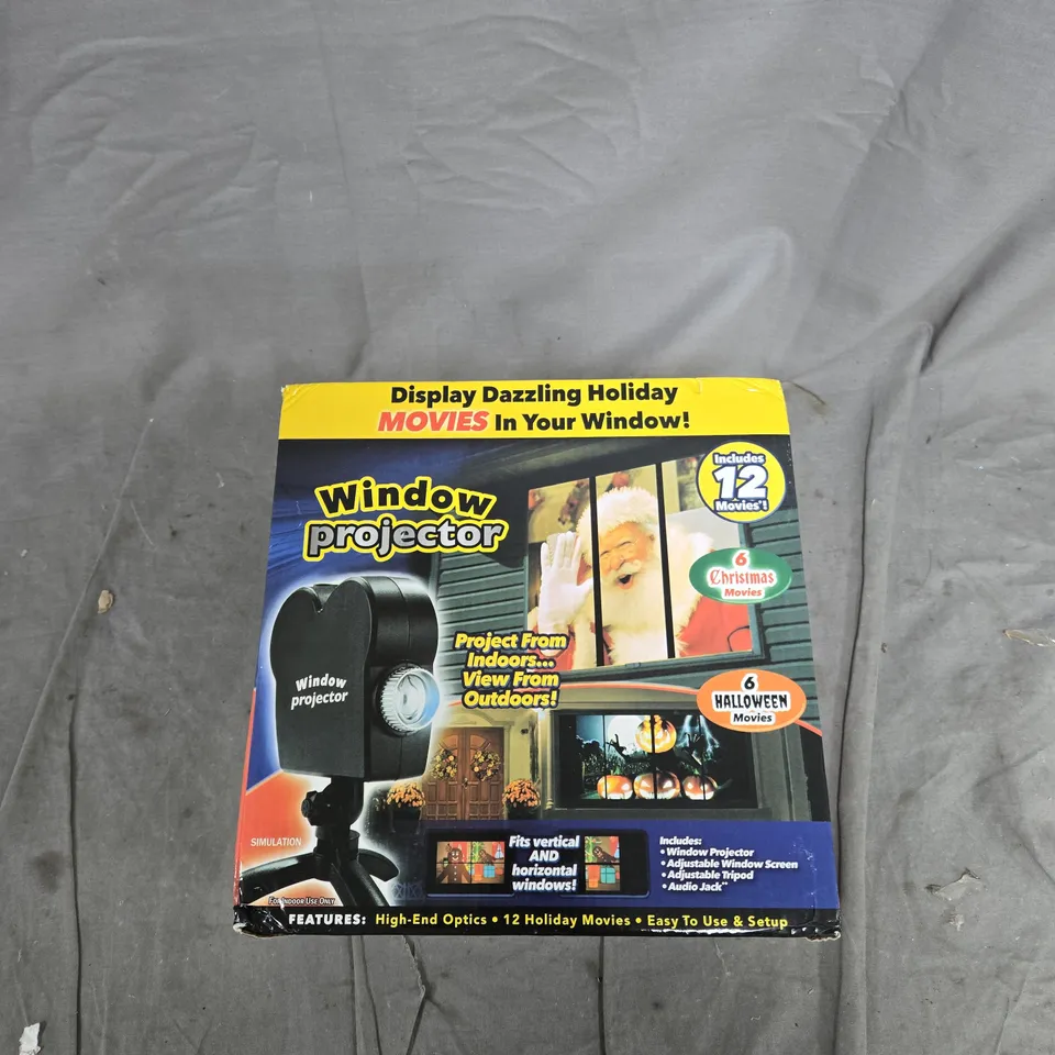 WINDOW PROJECTOR - INCLUDES 12 MOVIES (HOLIDAY & HALLOWEEN) - BOXED
