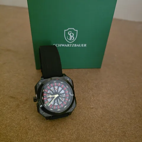 SCHWARTZBAUER WRISTWATCH – BLACK DIAL WITH SKELETON DISPLAY, RUBBER STRAP, BOXED