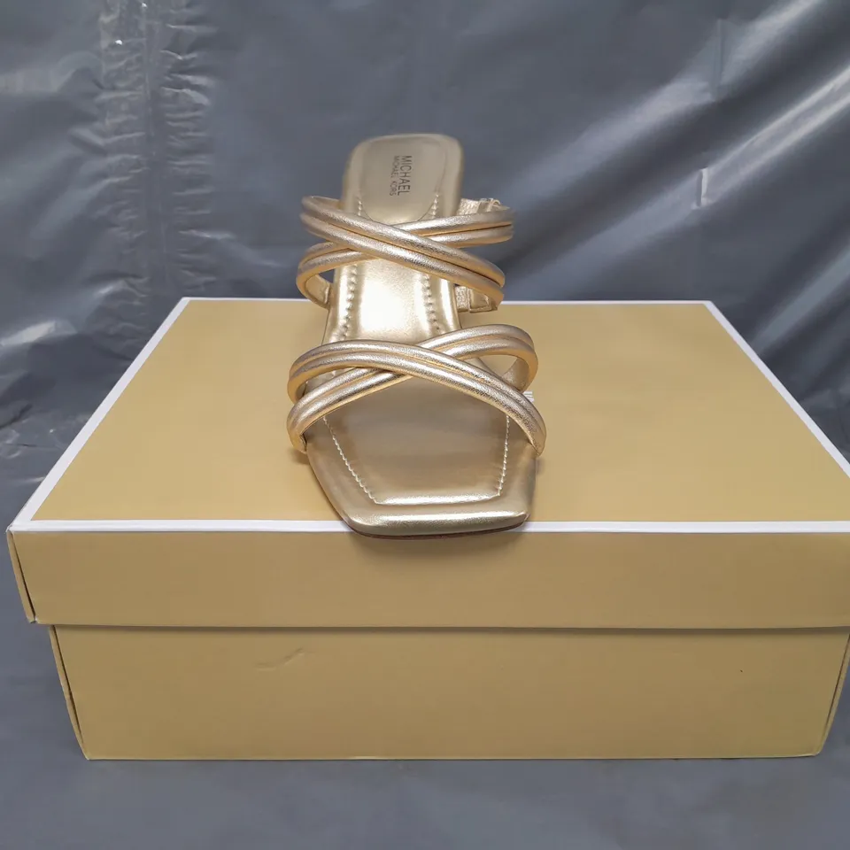 BOXED PAIR OF MICHAEL KORS OPEN TOE STRAPPY HEELED SANDALS IN METALLIC GOLD US SIZE 9