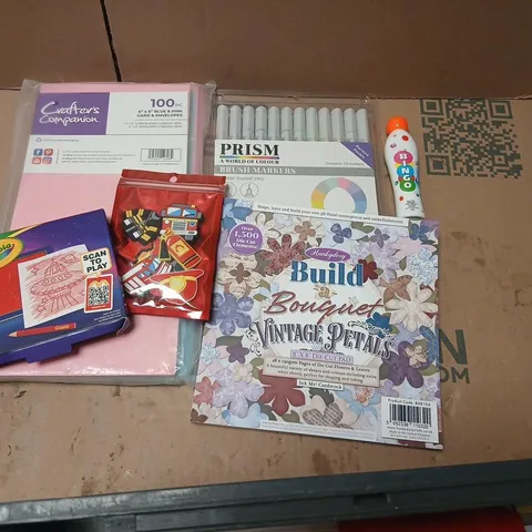 LARGE QUANTITY OF ASSORTED TOYS AND ACCESSORIES TO INCLUDE; CRAFTERS COMPANION BLUE AND PINK ENVELOPES, BINGO DABBER, PRISM BRUSH MARKERS AND BUILD A BOUQUET VINTAGE PETALS
