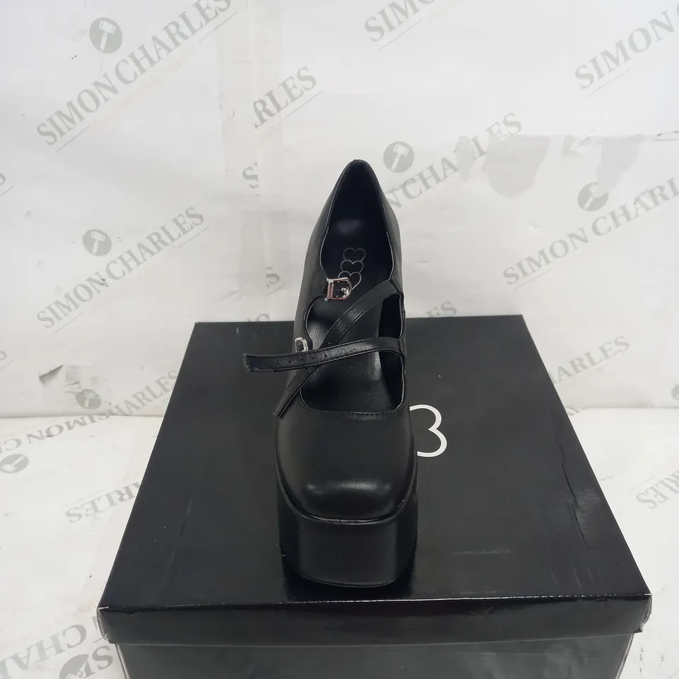 BOXED PAIR OF KOI FOOTWEAR PU STRAPPY PLATFORM HEEL IN BLACK - SIZE 5