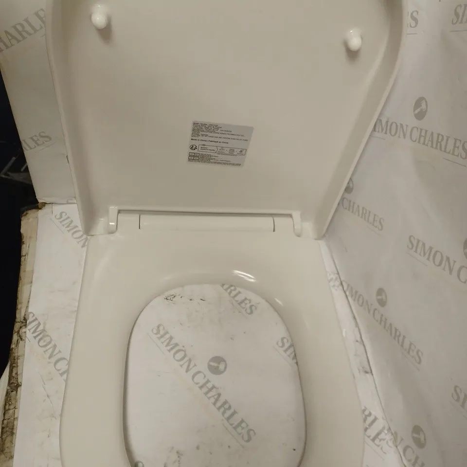 WHITE TOILET SEAT.