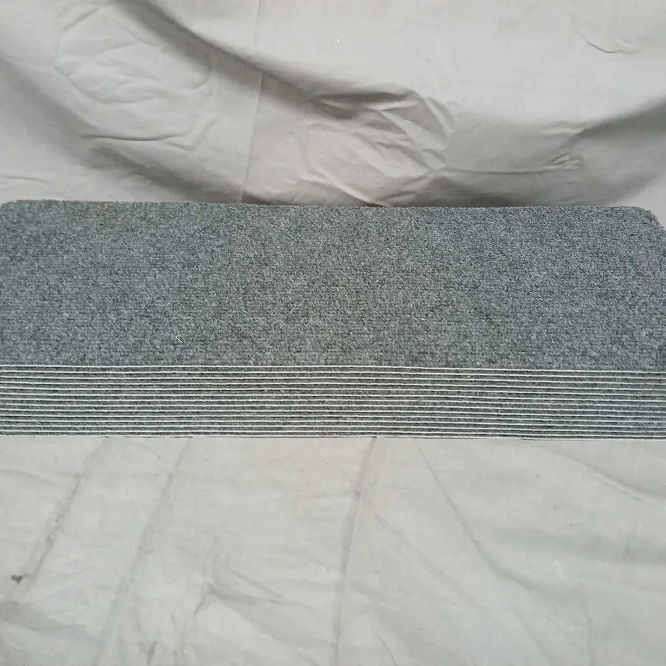 APPROXIMATELY 12 SELF ADHESIVE CARPET PADS IN GREY 
