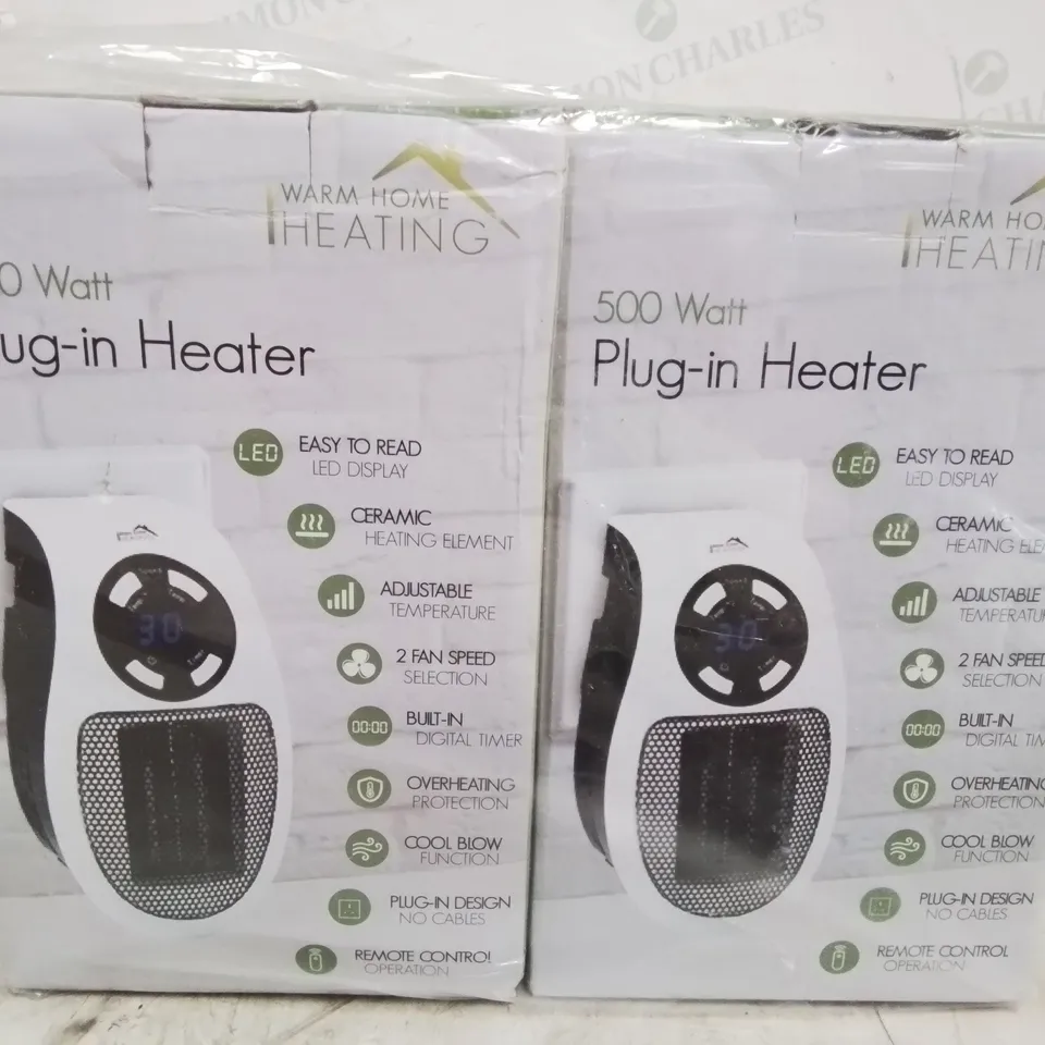 TWO BOXED 500 WATT PLUG IN HEATERS 