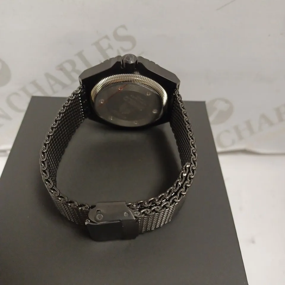 BOXED SHIELD WATCH - STAINLESS STEEL - JAPAN MOVEMENT - WATER RESISTANT 20 ATM - DATE DIAL.