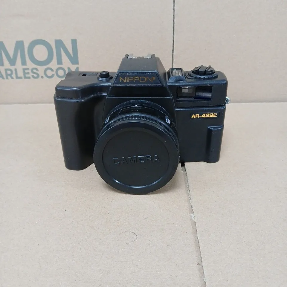 NIPPON AR-4392 35MM FILM CAMERA WITH ATTACHED LENS IN BLACK ZIP UP CASE