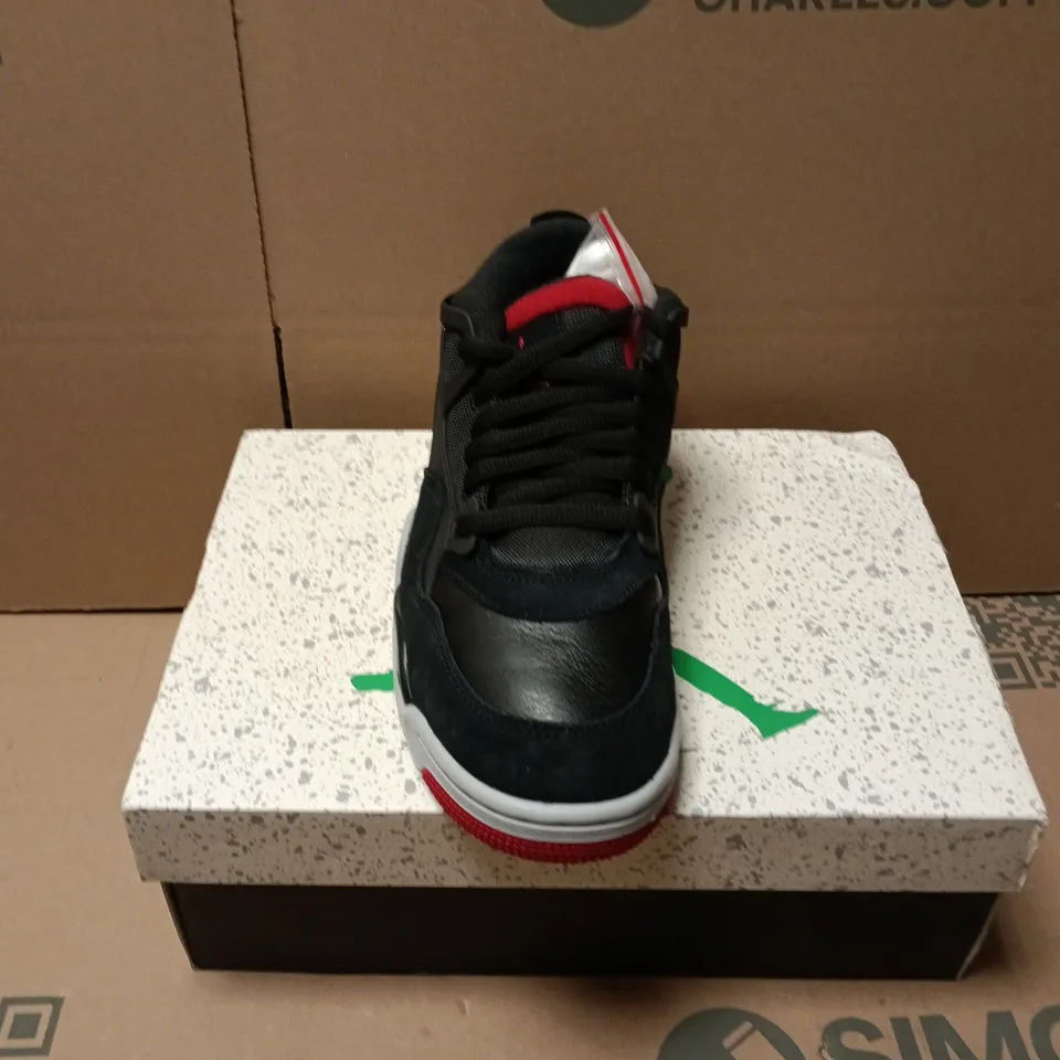 BOXED PAIR OF NIKE AIR JORDAN 4 RM TRAINERS IN BLACK - UK 7