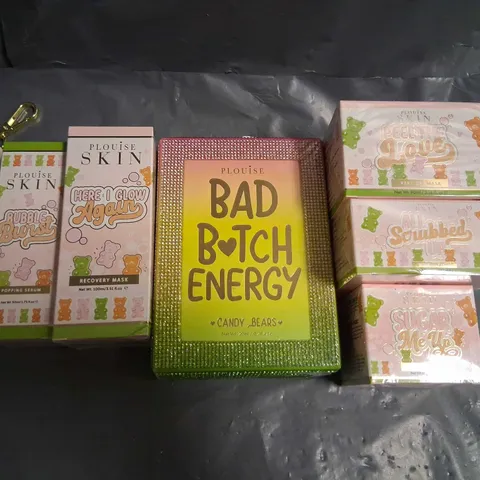 SEVEN ASSORTED PLOUISE SKIN BEAUTY PRODUCTS TO INCLUE; SUGAR ME UP FACE SCRUB, ALL SCRUBBED UP FRUIT BODY SCRUB, PEEL THE LOVE PEEL OFF MASK, BAD BITCH ENERGY CANDY BEARS SET, HERE I GLOW AGAIN RECOVE