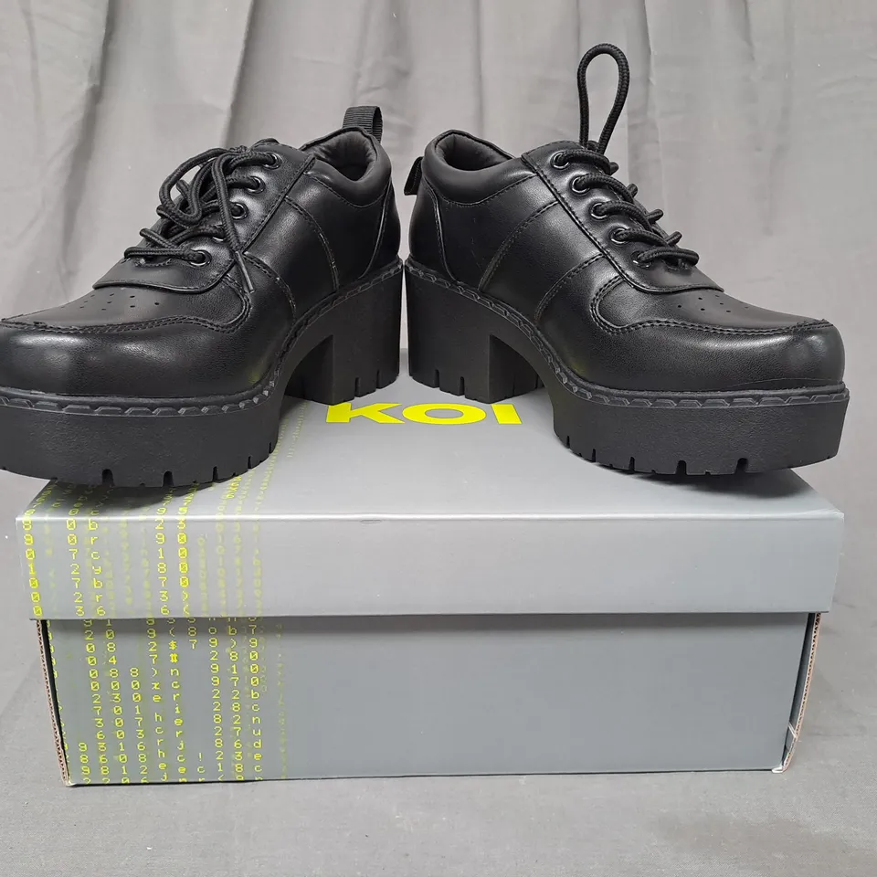 BOXED PAIR OF KOI OSHAN SWITCH SHOES IN BLACK UK SIZE 5