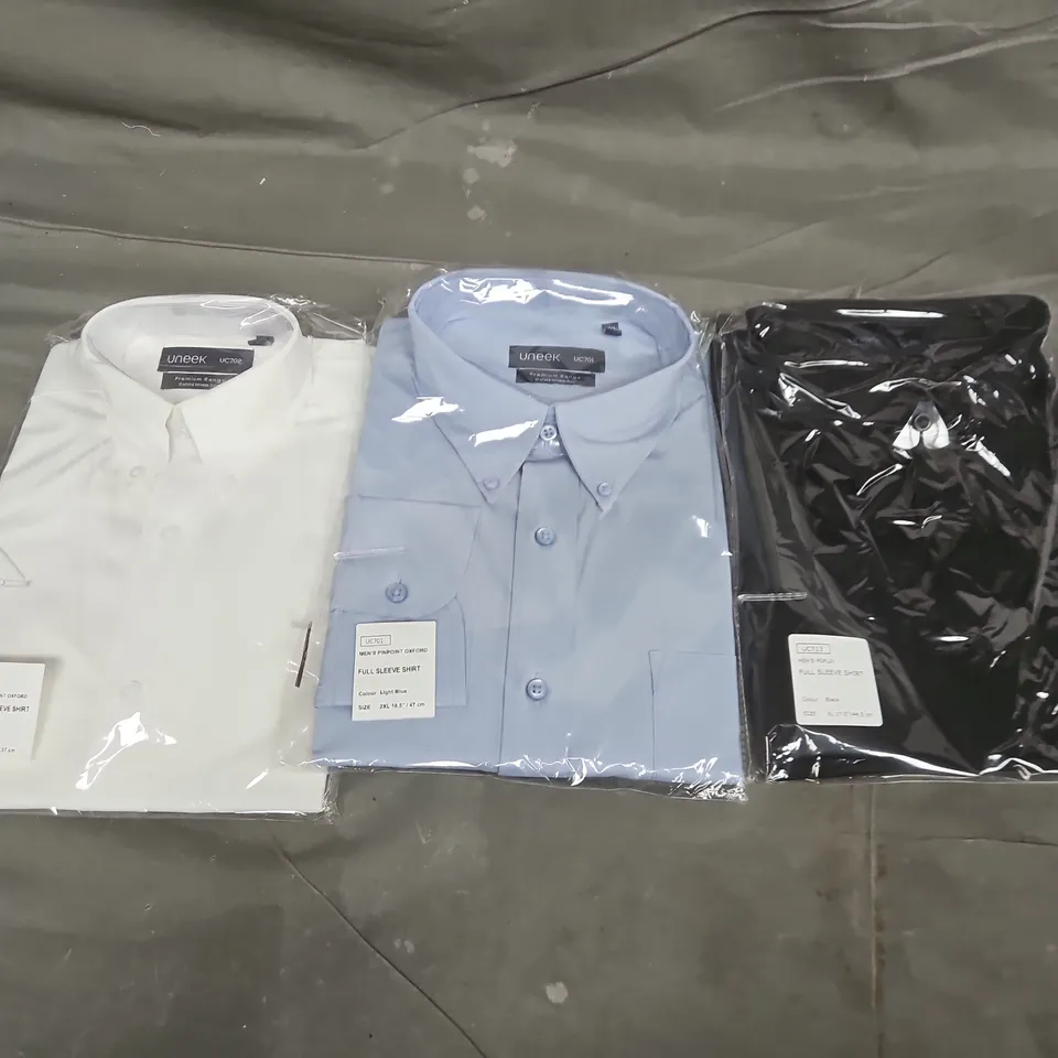 APPROXIMATELY 15 ASSORTED UNEEK SHIRTS IN VARIOUS SIZES & COLOURS TO INCLUDE BLACK, WHITE & LIGHT BLUE