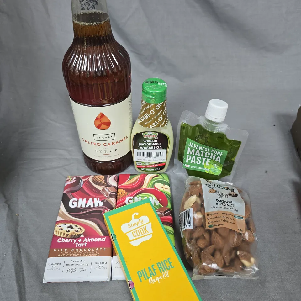 LOT OF 10 ASSORTED FOOD ITEMS TO INCLUDE THORNTONS CHOCOLATE, CARAMEL SYRUP AND GNAW CHOCOLATE BARS