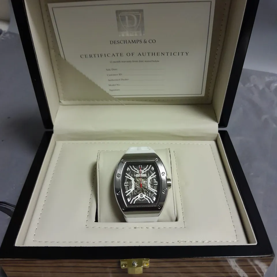 MENS AUTOMATIC DESCHAMPS & CO WATCH WITH SKELETON DIAL, GLASS EXHIBITION BACK CASE, RUBBER STRAP AND WOODEN GIFT BOX