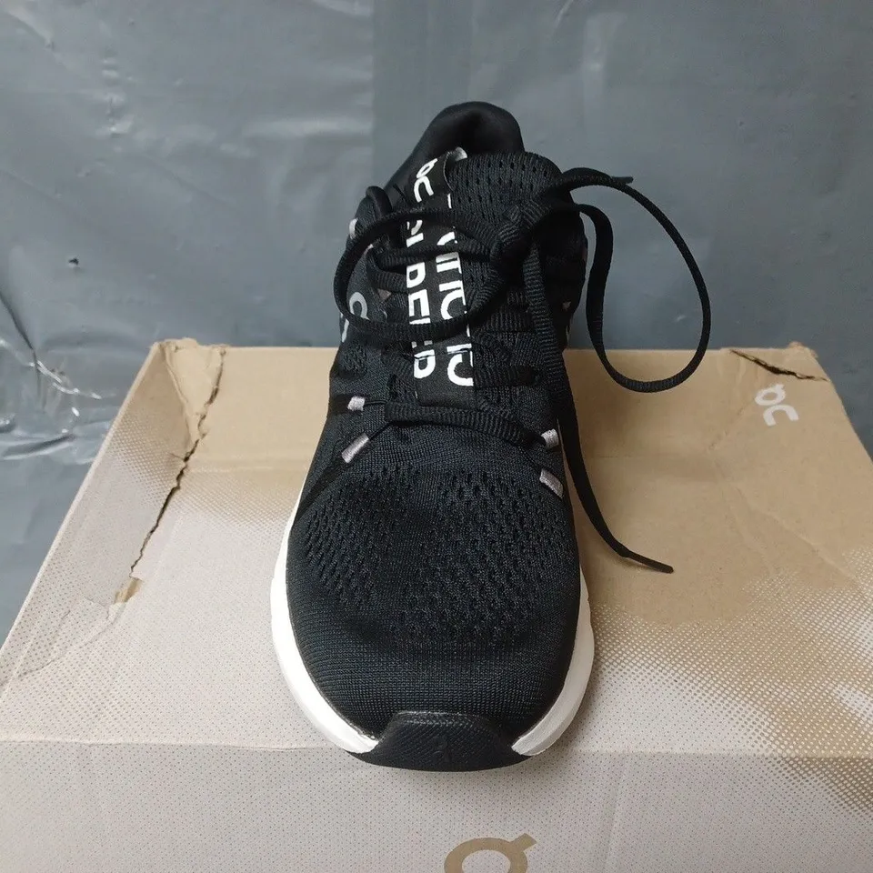 BOXED PAIR OF ON CLOUDSURFER TRAINERS IN BLACK/WHITE - UK 6
