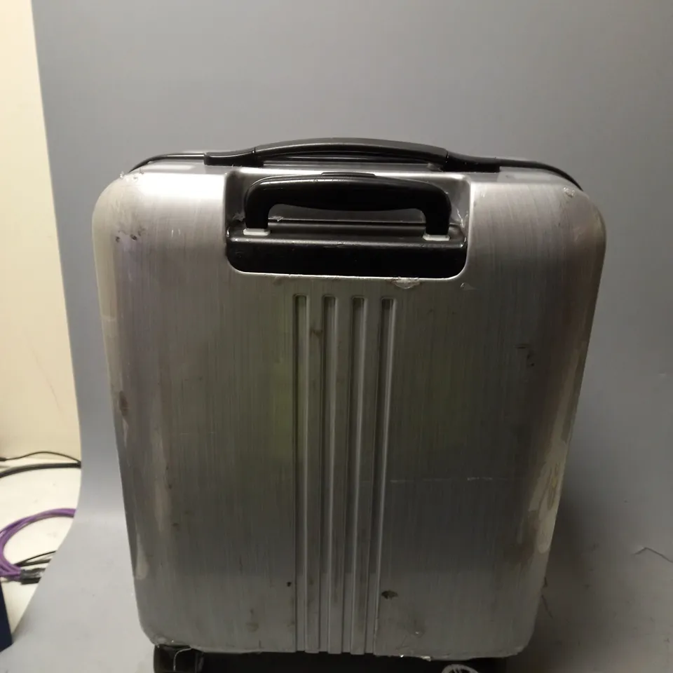 UNBRANDED PLASTIC SILVER CARRY ON CASE WITH 4 WHEELS 