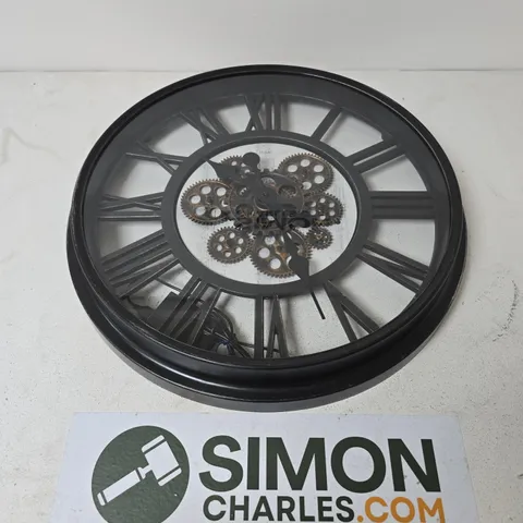 ROUND BLACK METAL WALL CLOCK WITH EXPOSED GEARWORK AND ROMAN NUMERALS