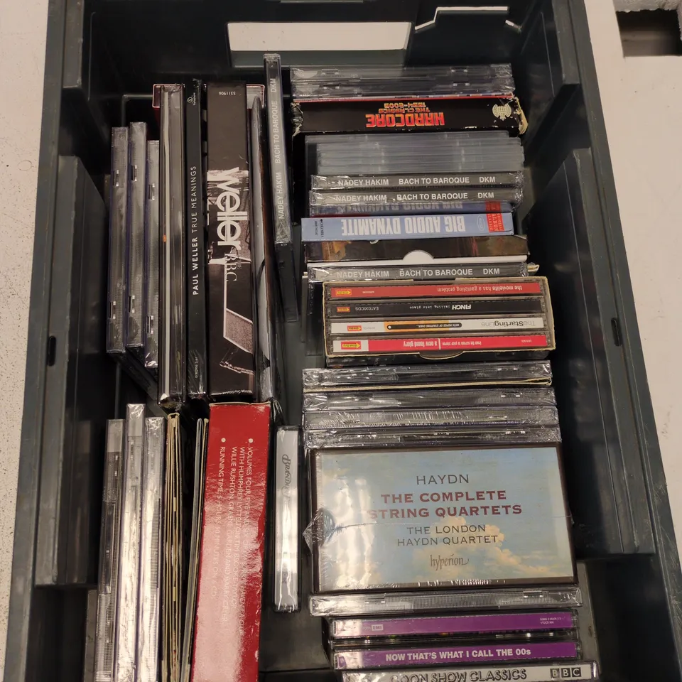 BOX CONTAINING A MIX OF APPROXIMATELY 20 CD'S INCLUDING PAUL WELLER, BAND ON THE RUN, THATS WHAT I CALL 2000'S