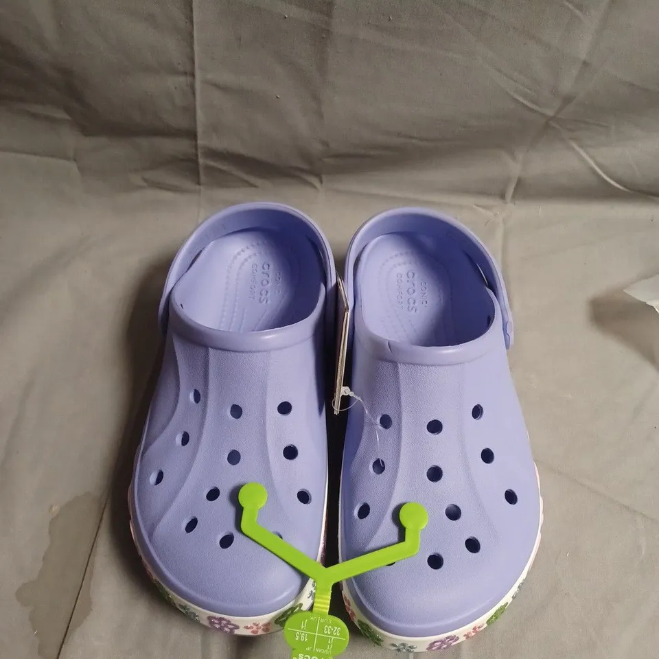 PAIR OF CROCS KIDS' LILAC CLOGS WITH FLORAL PATTERN – UK SIZE J1