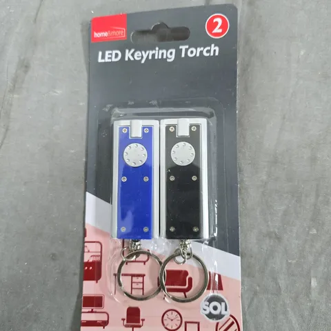 TOTE OF APPROXIMATELY 15 ASSORTED ITEMS TO INCLUDE: LED KEYRINGS AND GLASS BALL 