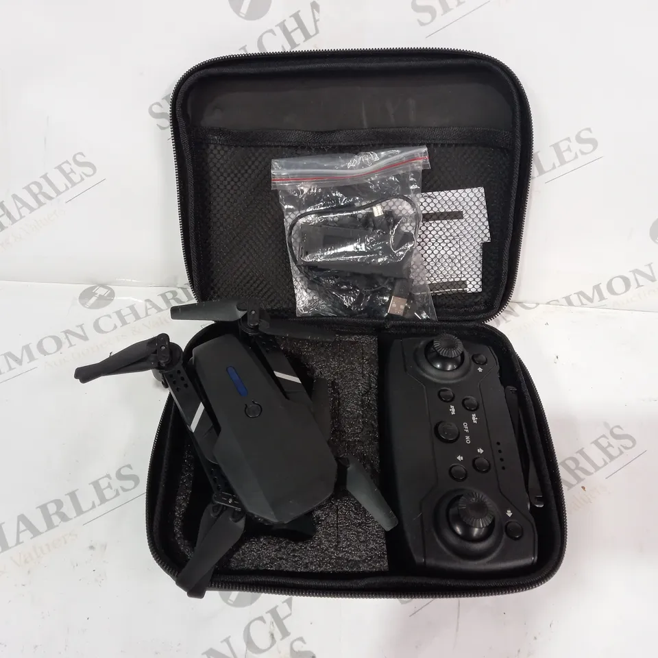 BLACK DRONE WITH CONTROL PAD AND CASE