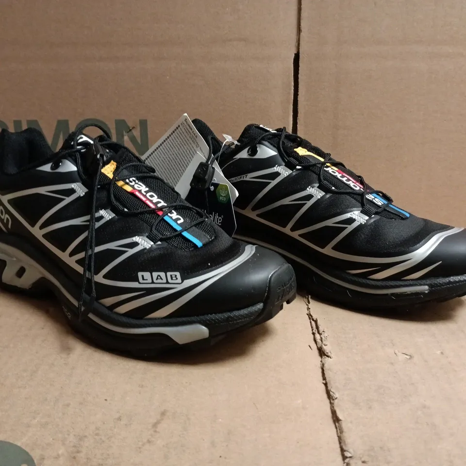 salomon trainers in black/sillver size uk 5