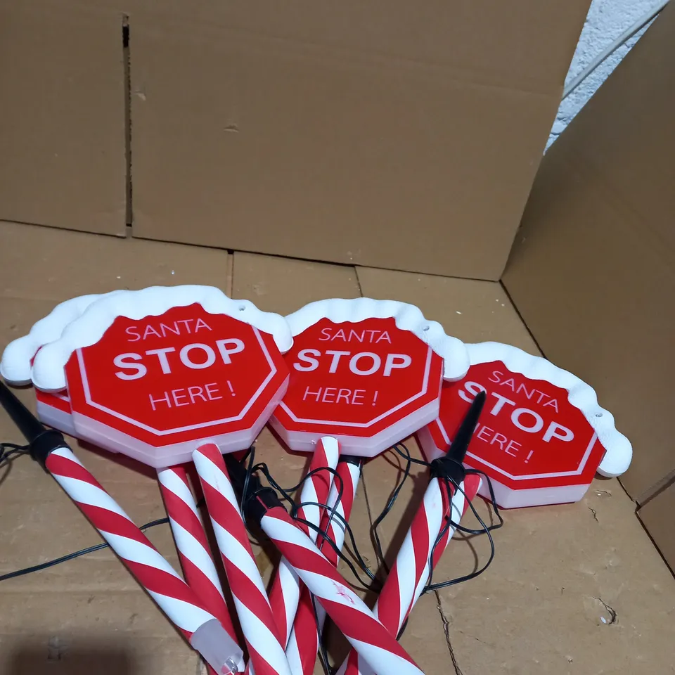FESTIVE SET OF PRELIT SANTA STOP HERE STAKES