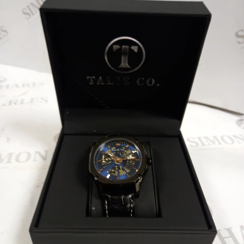 MEN’S TALIS CO 9185 AUTOMATIC SKELETON WATCH – BLUE DIAL – BLACK COLOUR CASE – GLASS EXHIBITION CASE BACK – LEATHER STRAP