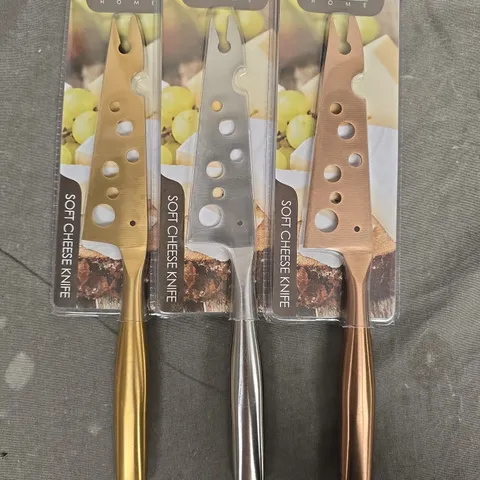 SET OF CORE HOME GOLD/SILVER/BRONZE SOFT CHEESE KNIVES