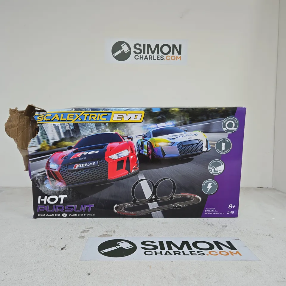 SCALEXTRIC EVO HOT PURSUIT SLOT CAR RACING SET – BOXED (DAMAGED BOX)