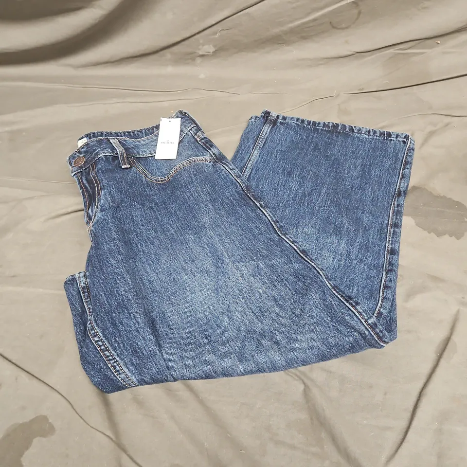 HOLLISTER LOW RISE BAGGY JEANS IN DARK BLUE SIZE W30 SHORT