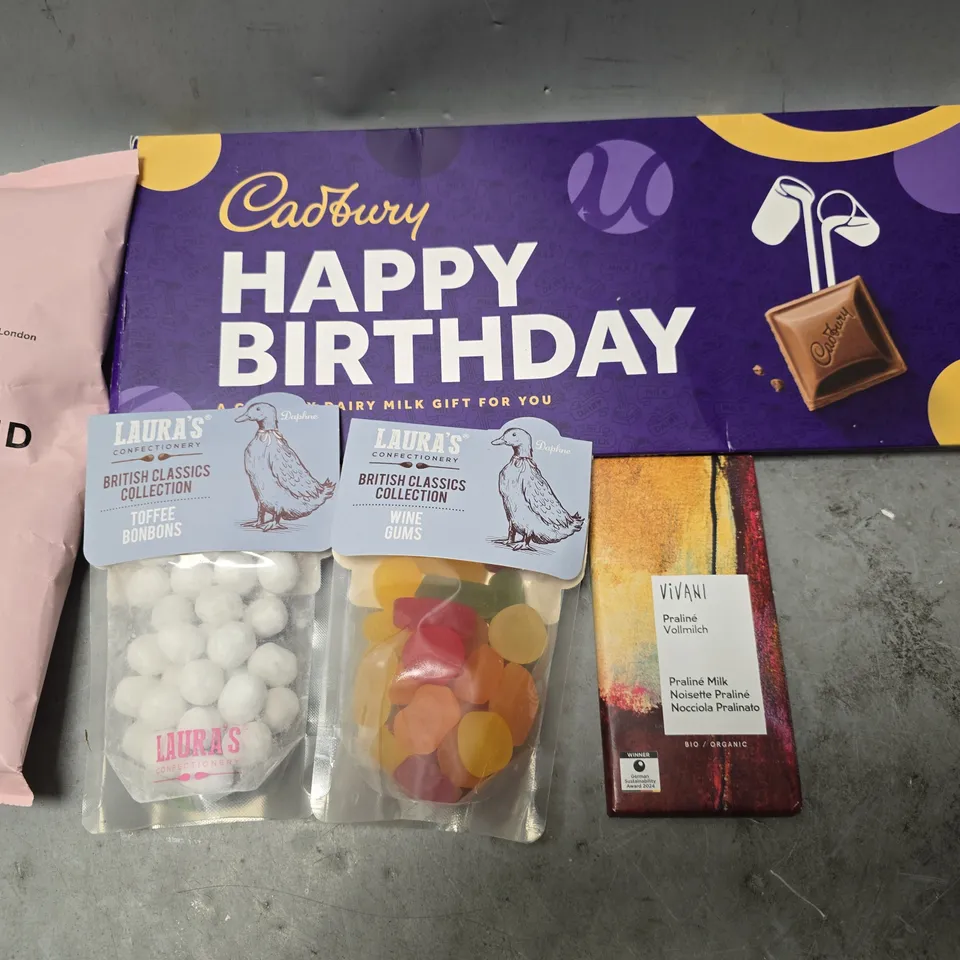 APPROXIMATELY 10 ASSORTED FOOD ITEMS TO INCLUDE - CADBURYS CHOCOLATE BAR , VIVANI PRALINE MILK CHOCOLATE BAR , GRIND HOUSE BLEND ETC