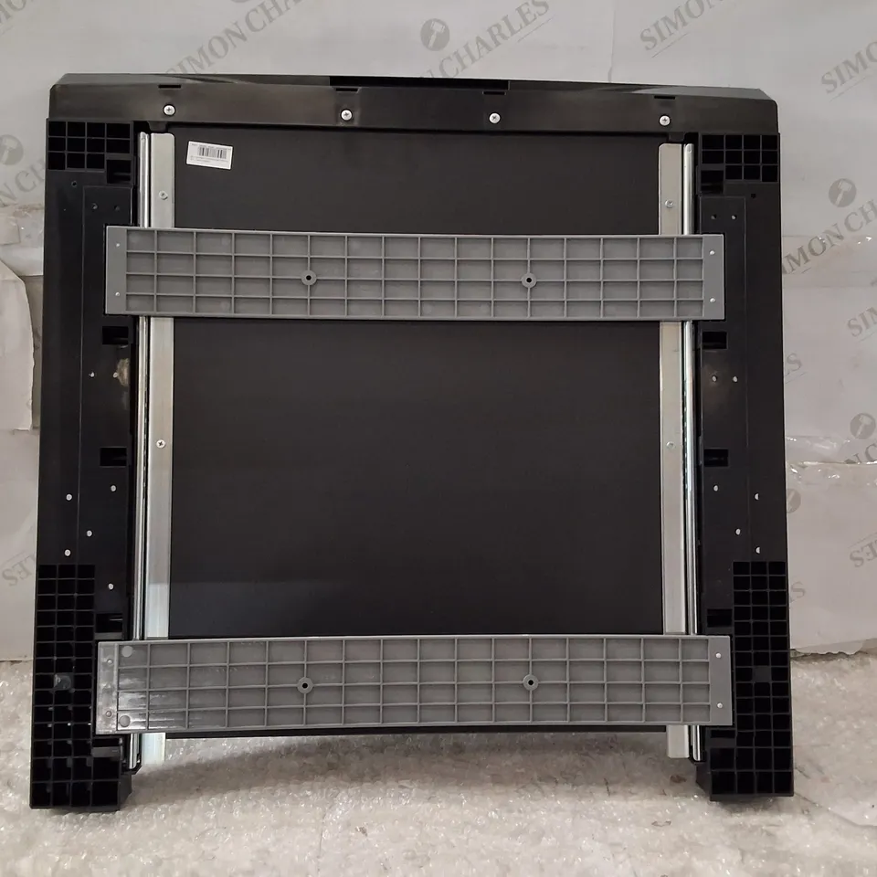 Black plastic chassis/slot component (Model WZXX90-BE B001-000) – likely peripheral